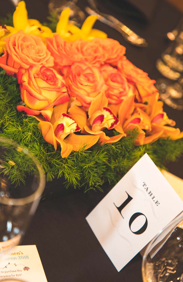 table centerpiece of orange roses