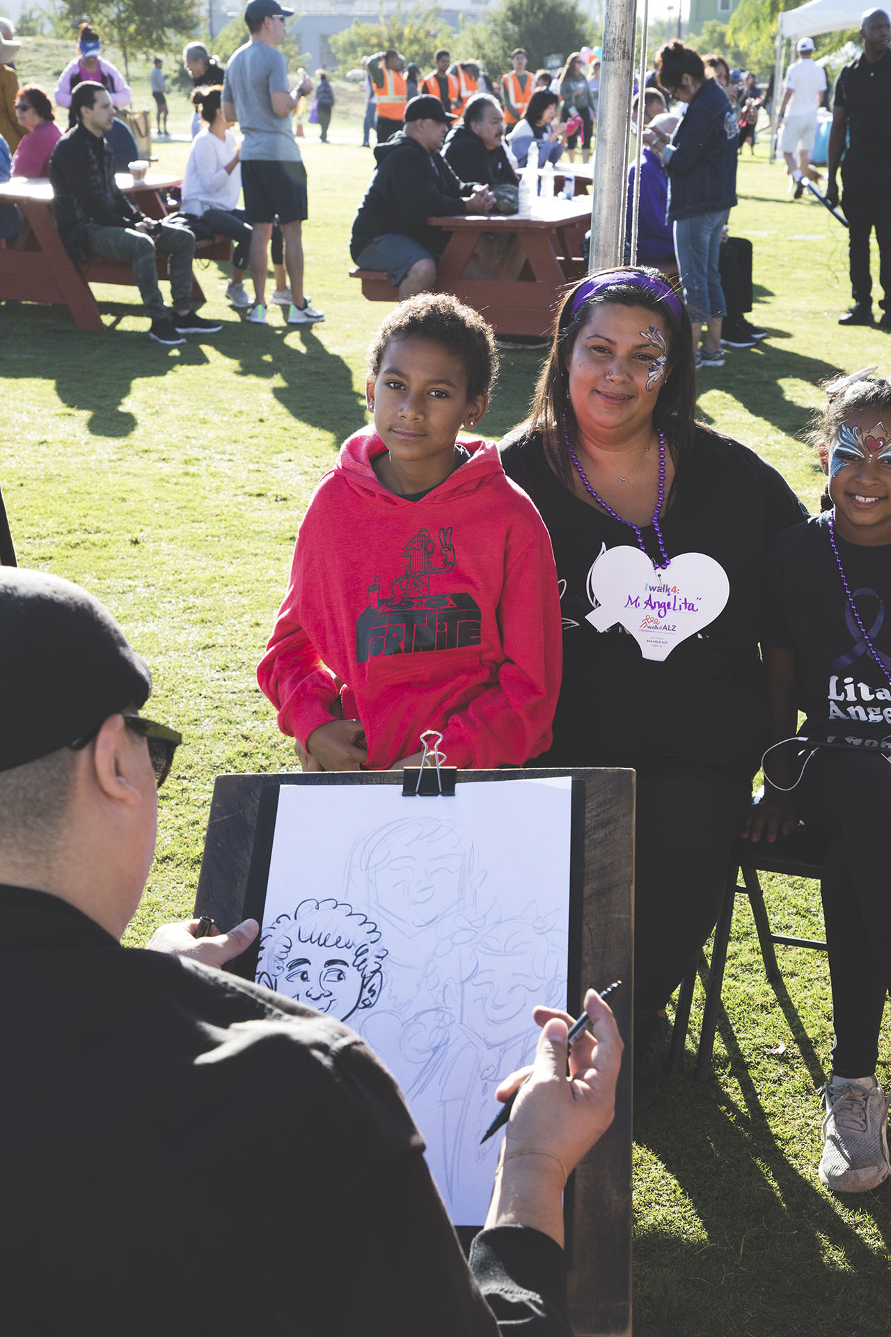 participants getting their caricatures drawn