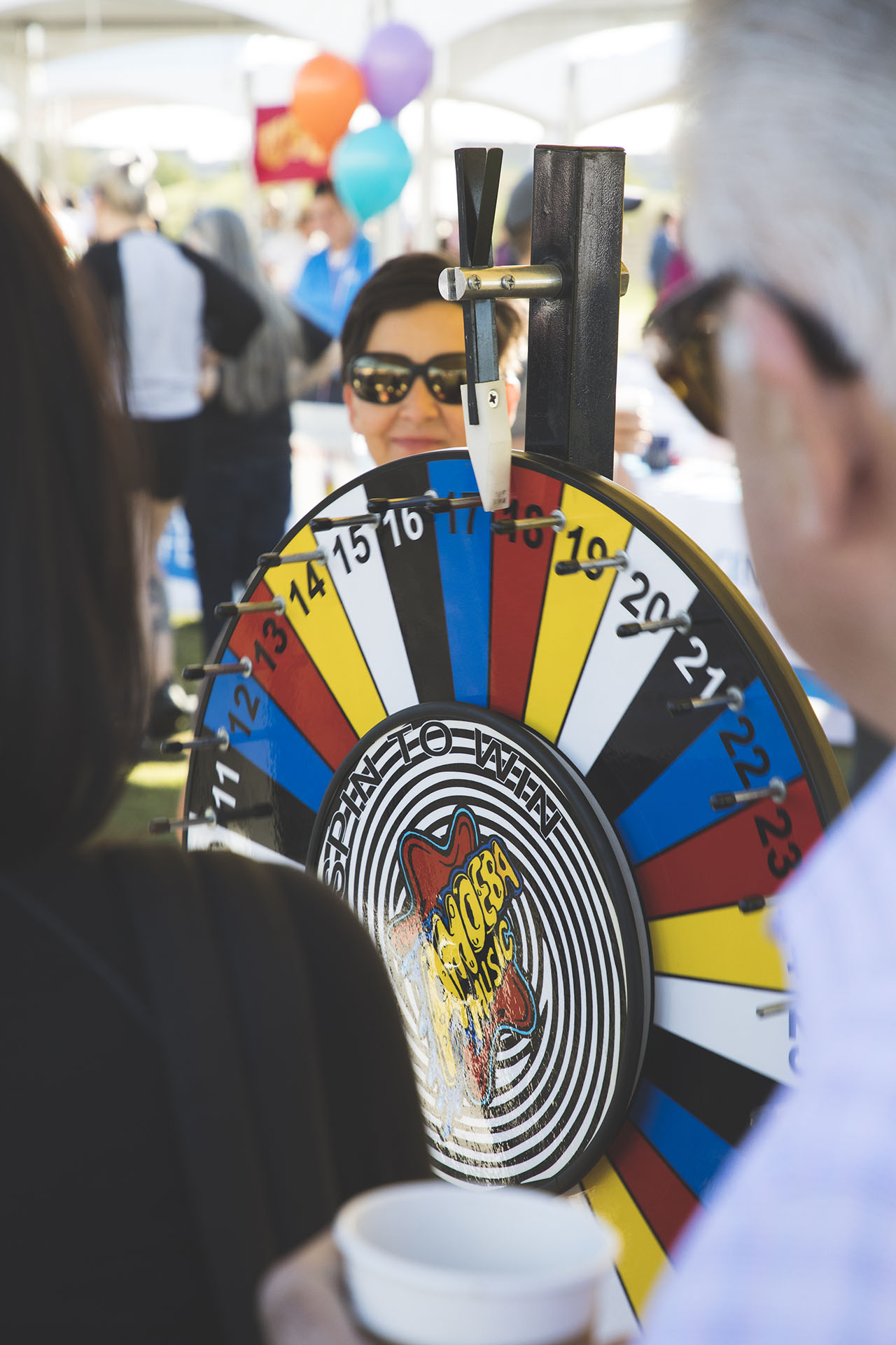 walkers spinning prize wheel at Amoeba booth