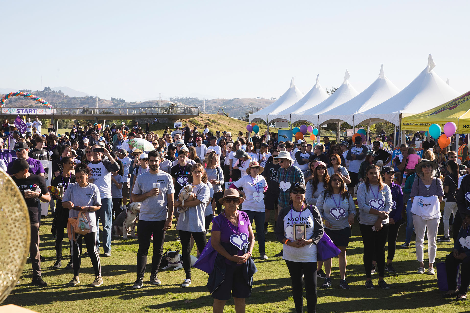 participants gather in front of the stage