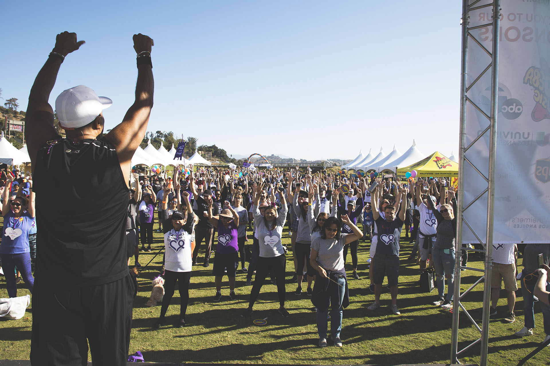 fitness instructor leads warm-up exercises