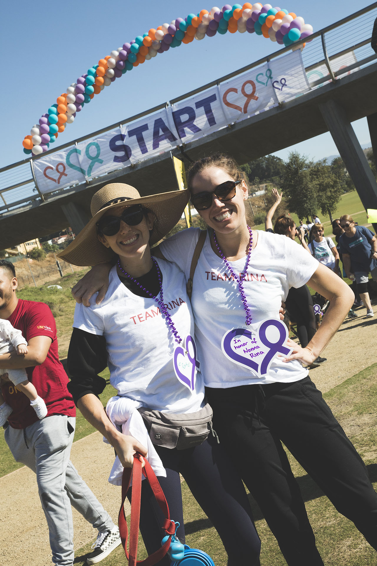 two walkers in front of start banner