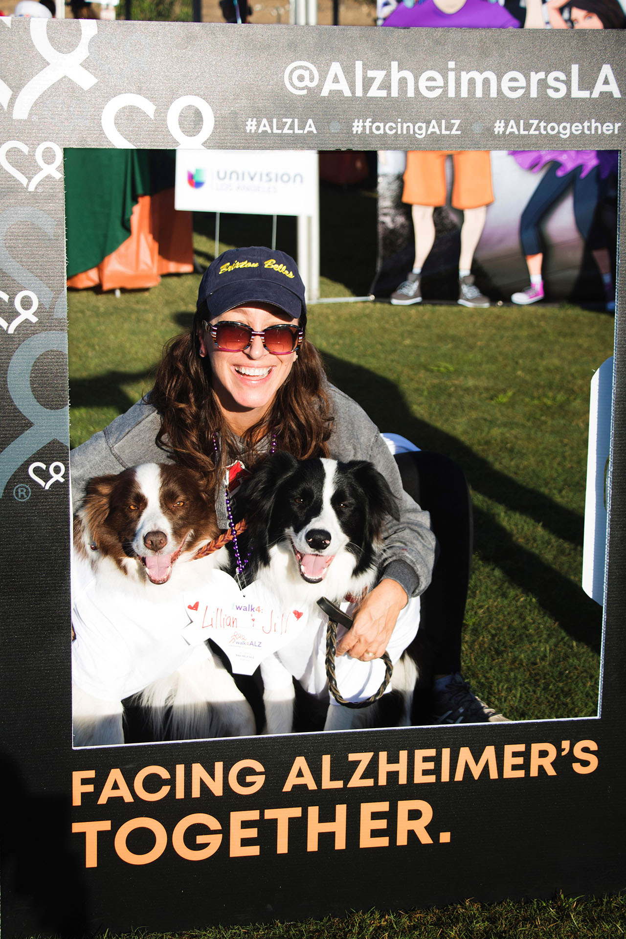 woman with her two dogs at social media booth