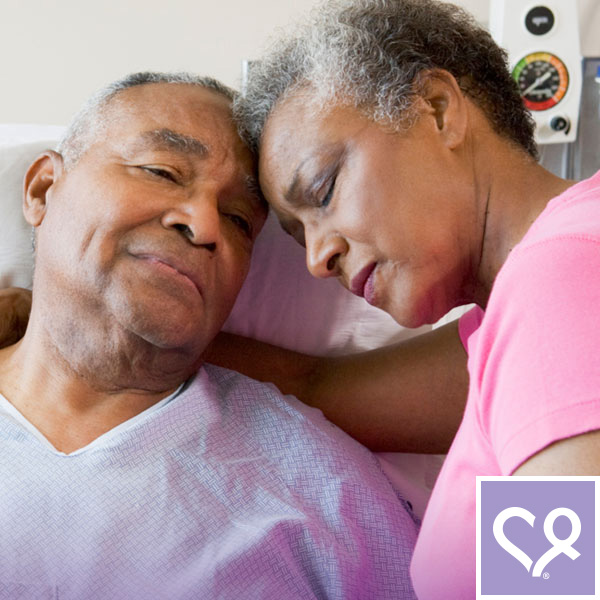 wife hugging husband in hospital