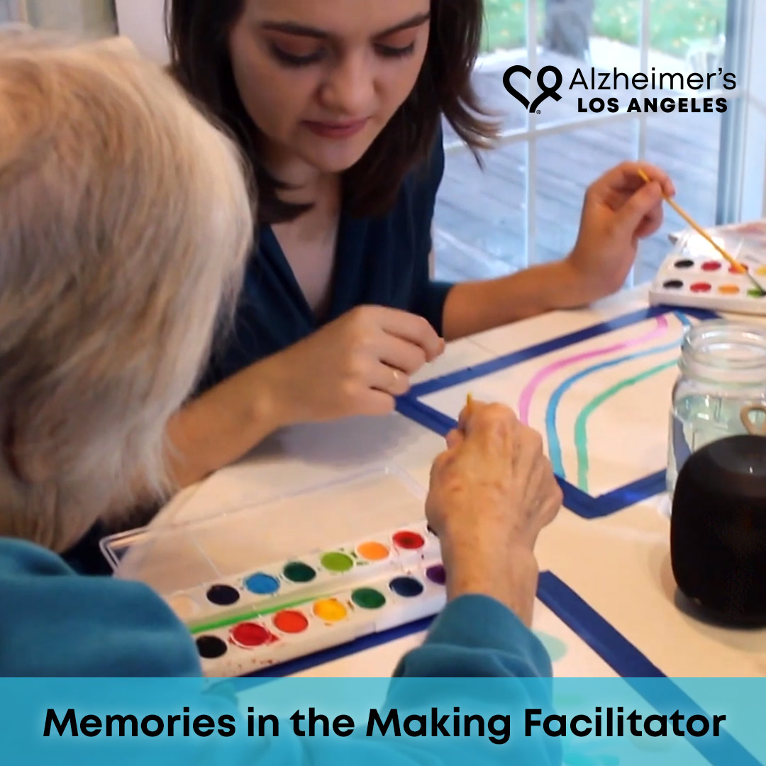 Memories in the Making volunteer facilitating a watercolor session