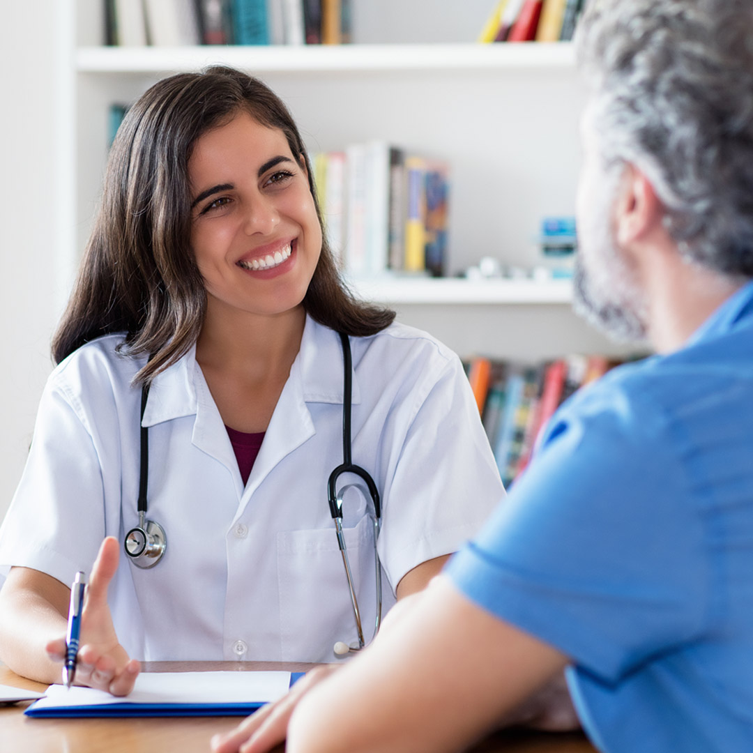 doctor smiling and talking with patient