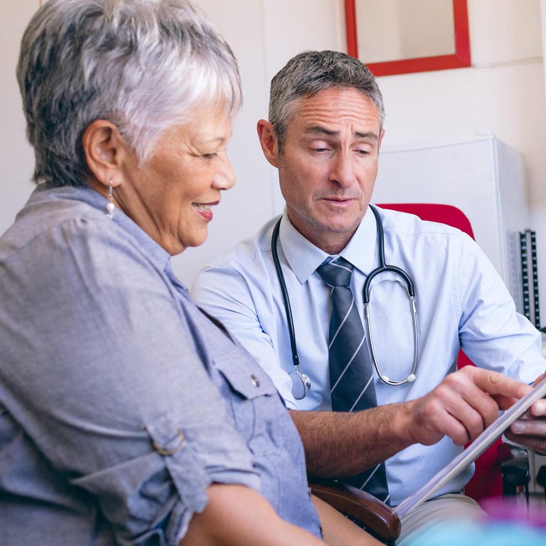 doctor reviewing written instructions with patient