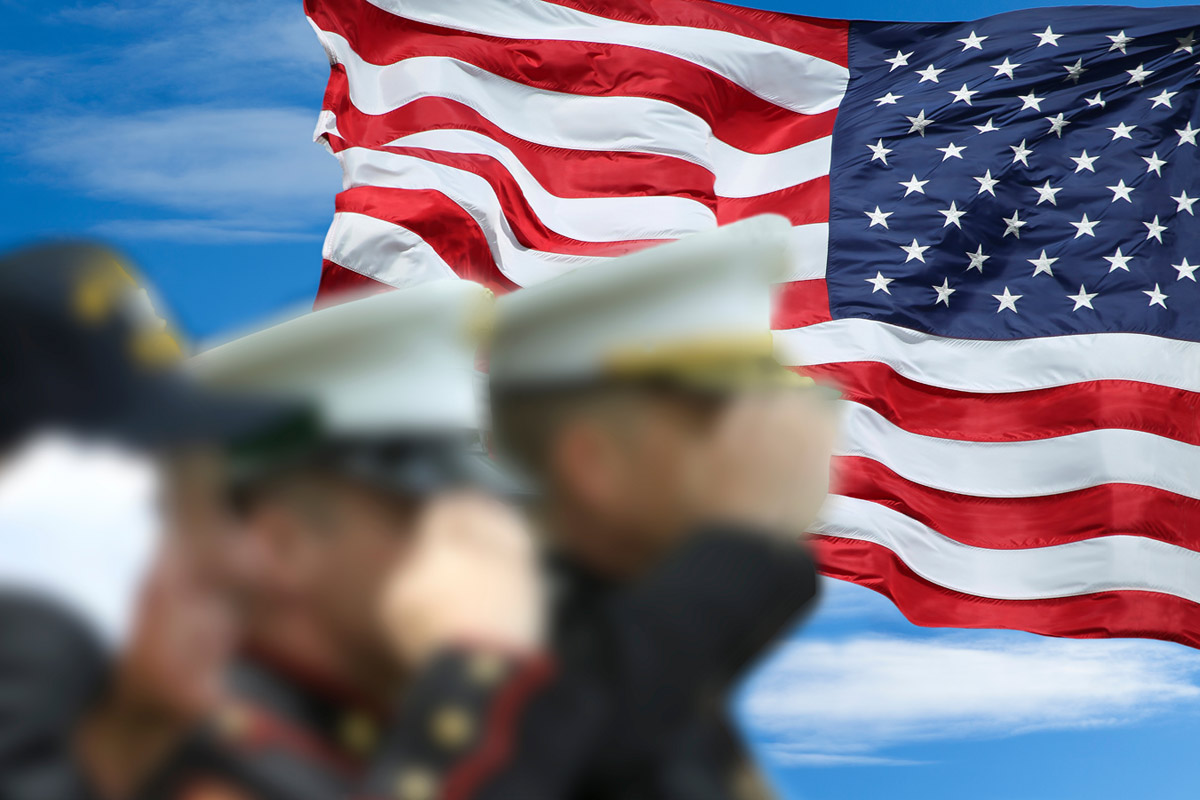 members of the armed forces saluting United States of America flag