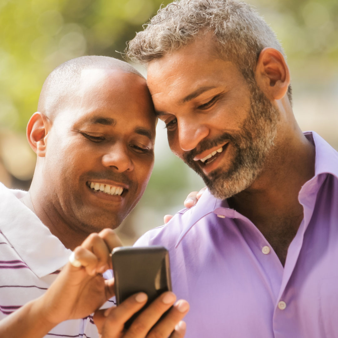 gay couple looking at phone together