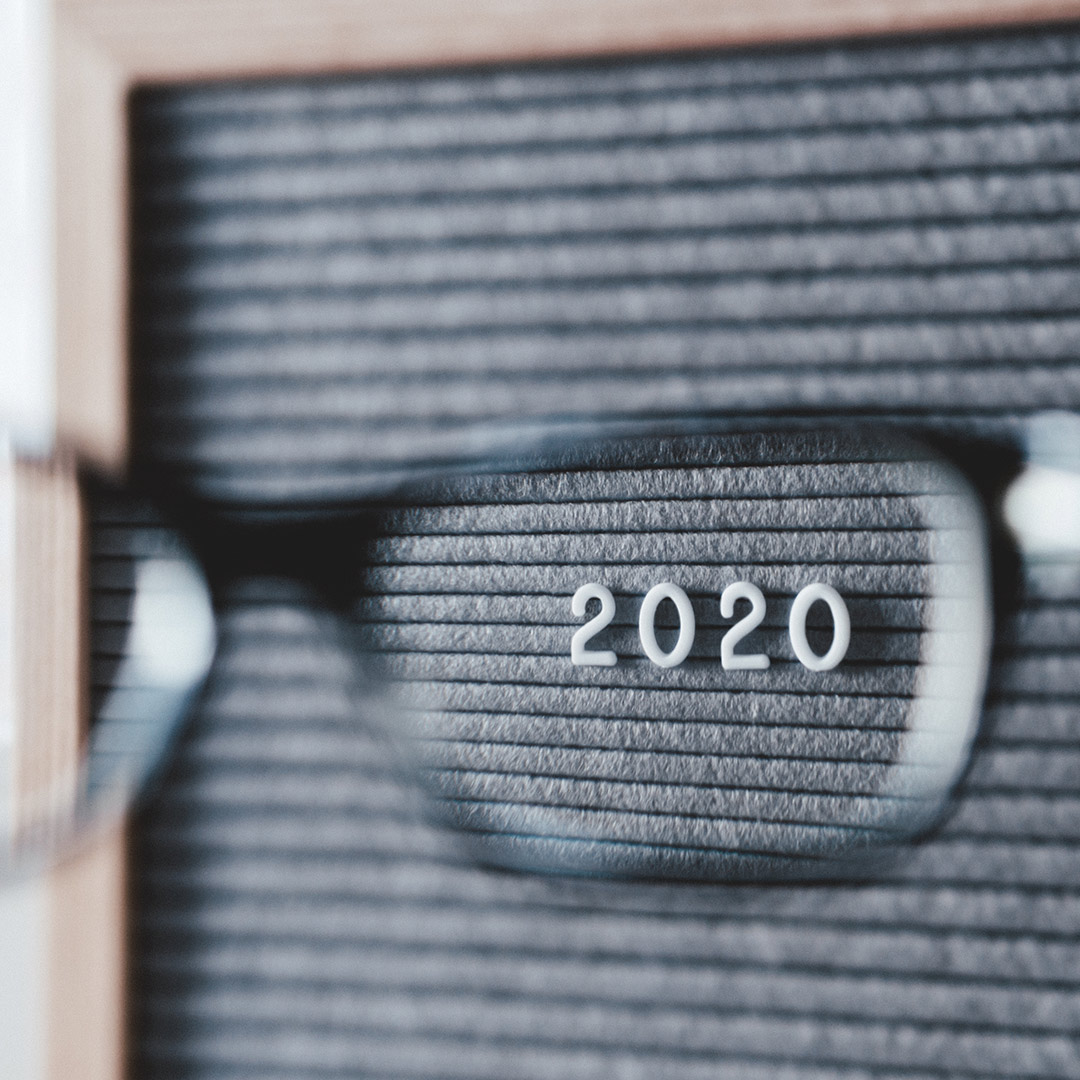 glasses magnifying a Year 2020 sign