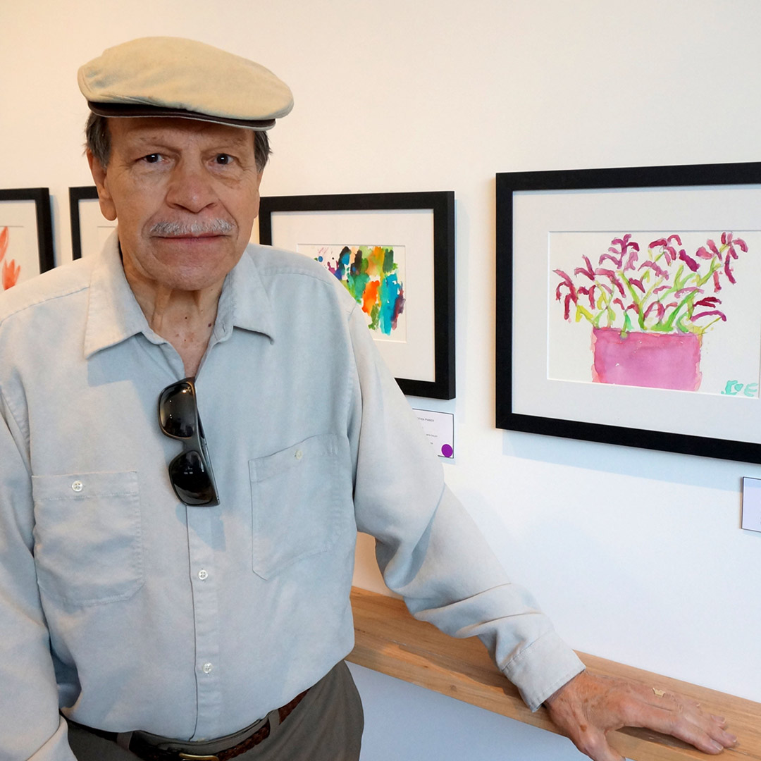 man with his painting at Memories in the Making exhibition 2015