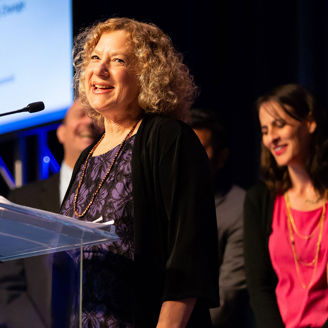 Debra Cherry speaking at podium - SCAN award ceremony 2018