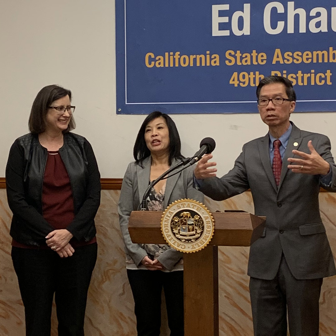 Ed Chau speaking at podium