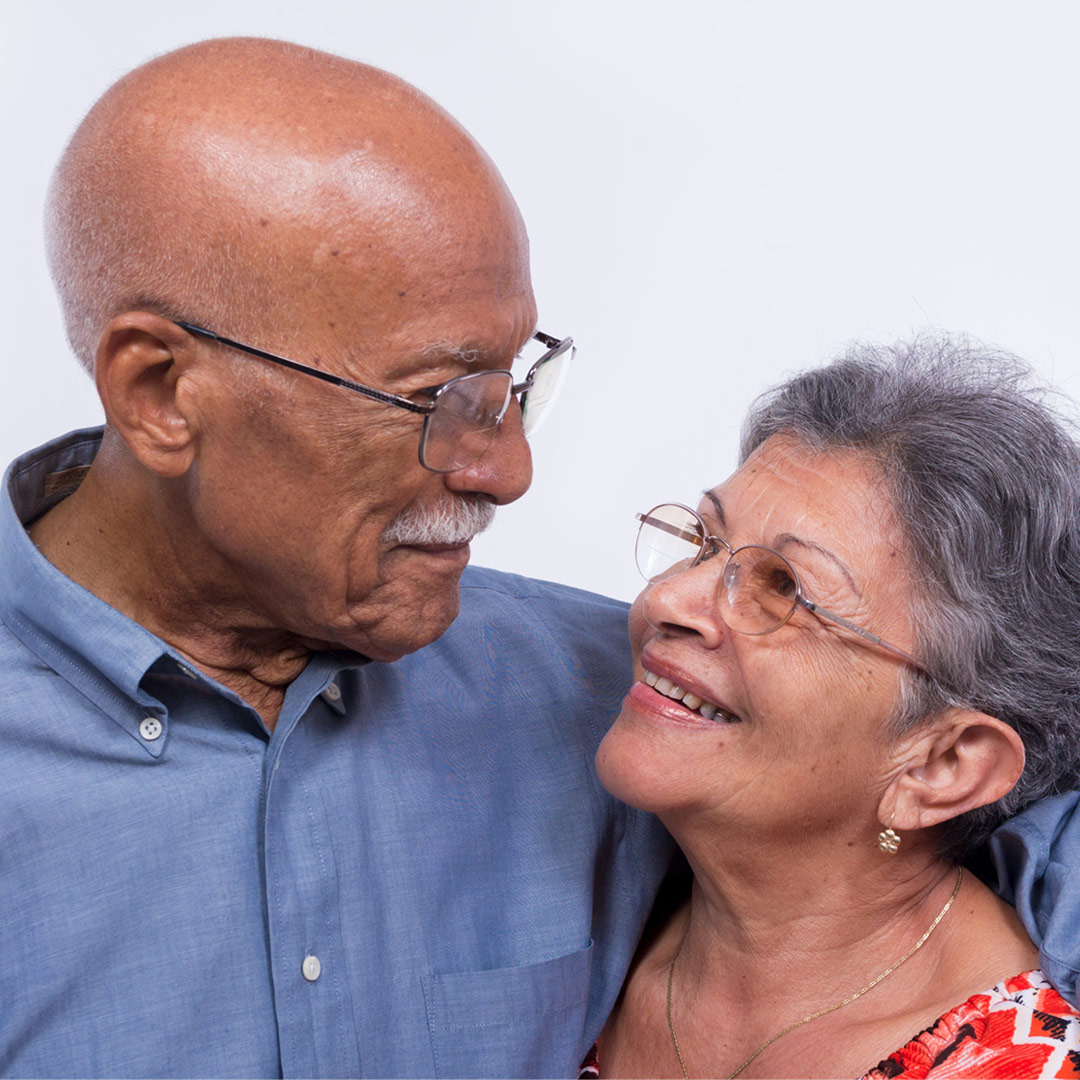 couple hugging and smiling at each other