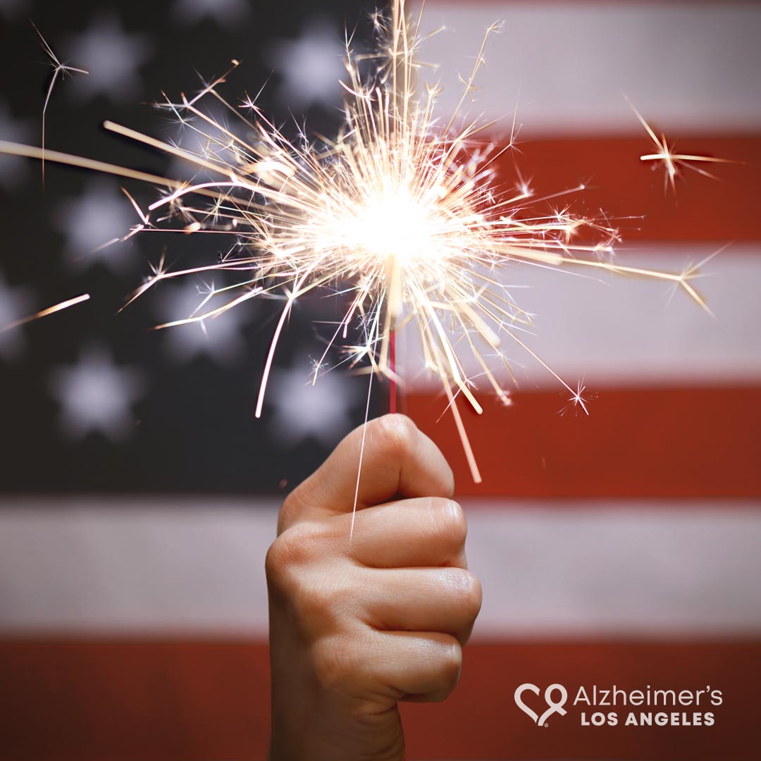 July 4th -holding sparkler flag background