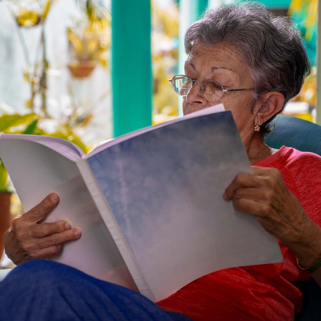 woman reading a book at home