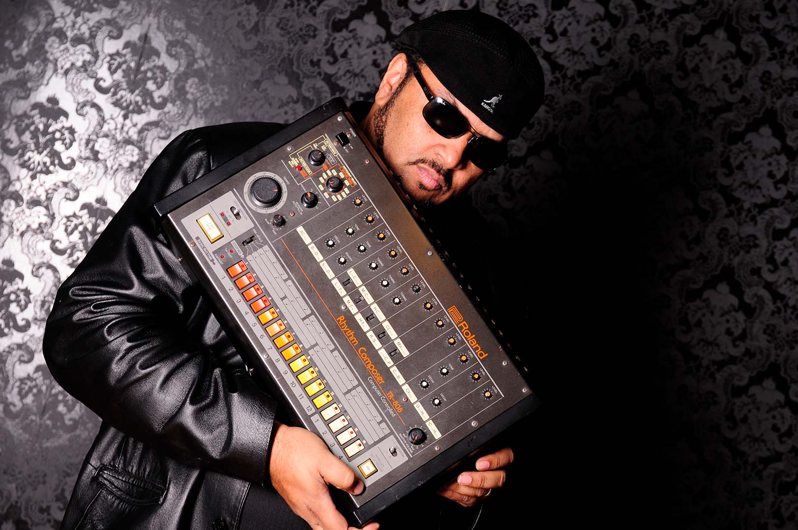 Egyptian Lover holding a Roland TR-808