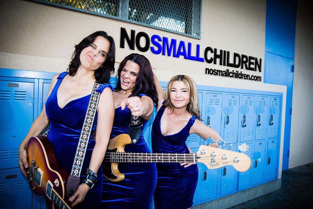 members of No Small Children standing in front of school lockers