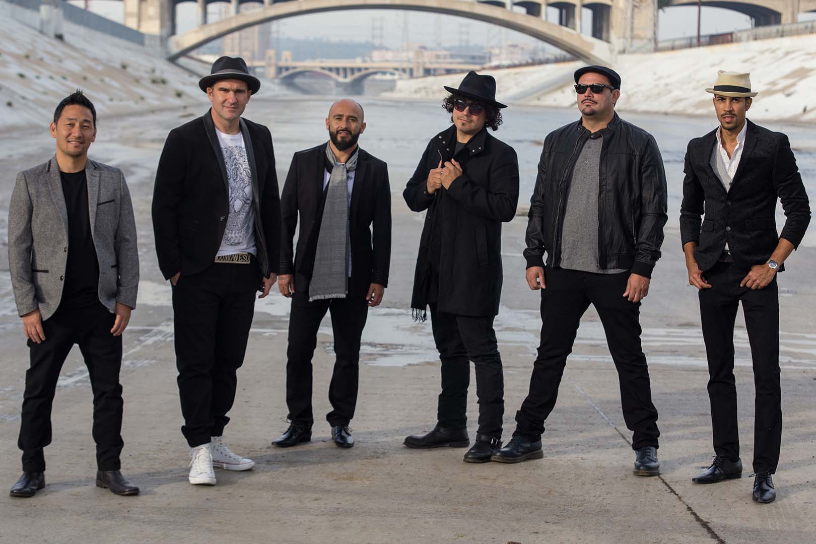 Ozomatli standing in dry basin of the Los Angeles River