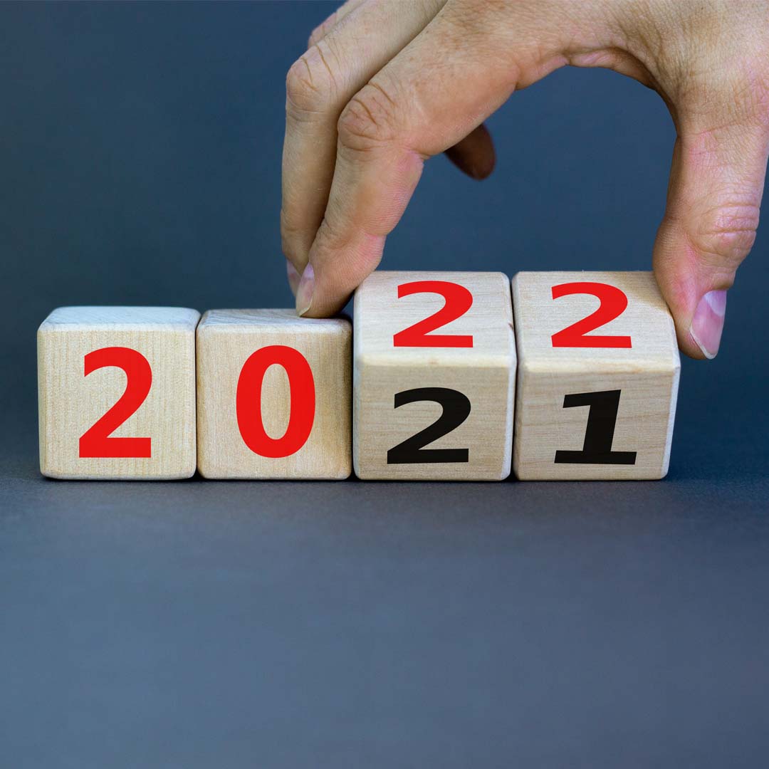 hand turning calendar from 2021 to 2022