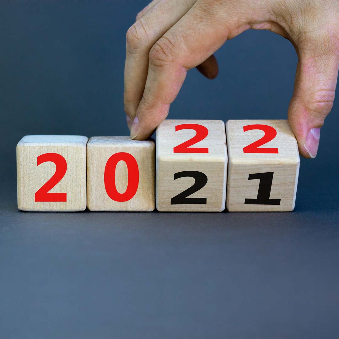 calendar-2021-turns-to-2022 hand turning calendar from 2021 to 2022