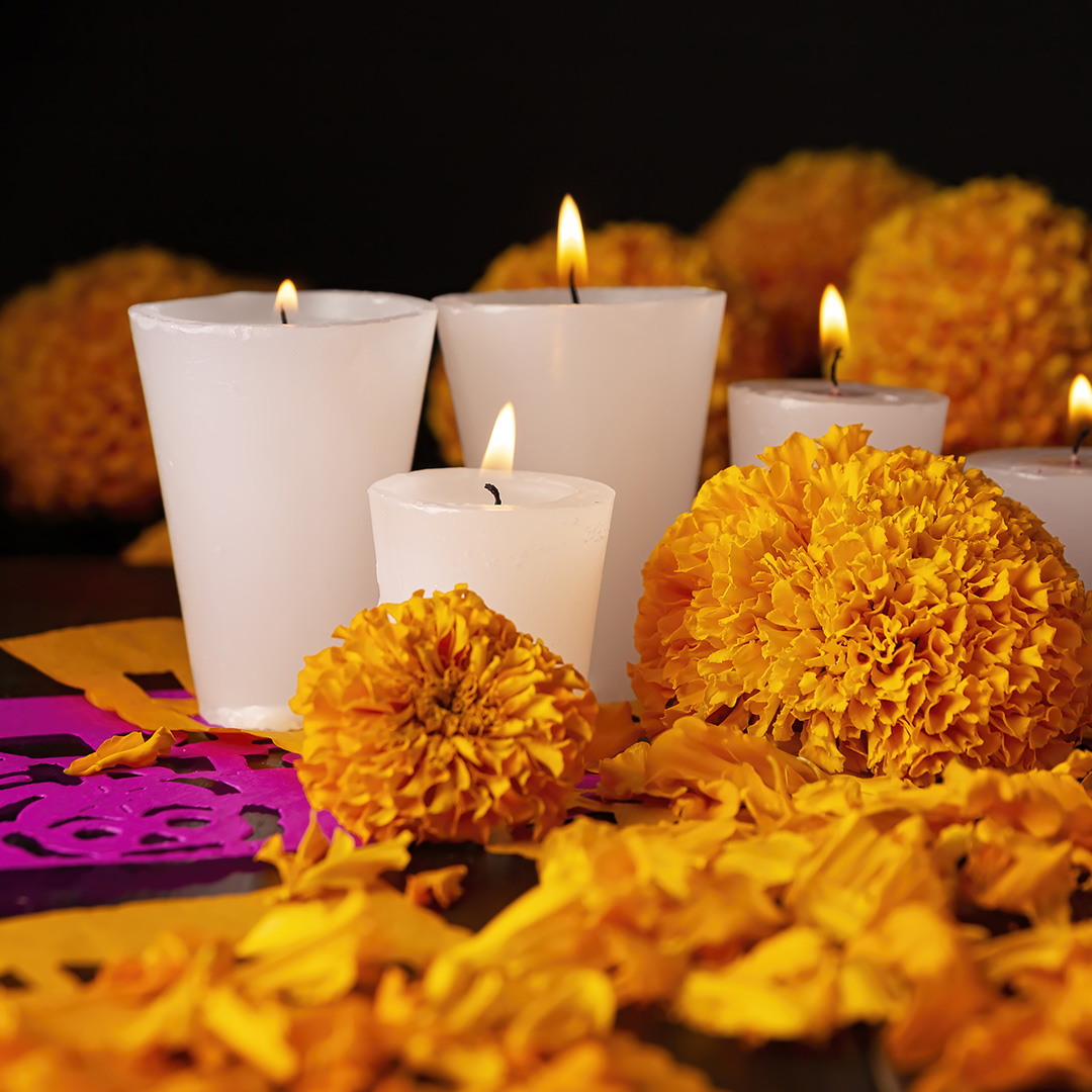 candles and marigolds on altar