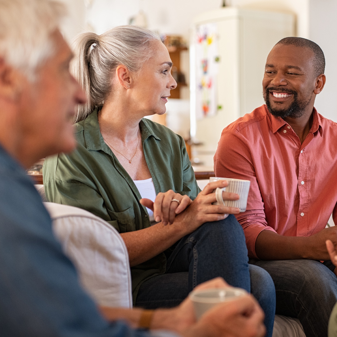 group of friends having coffee and talking