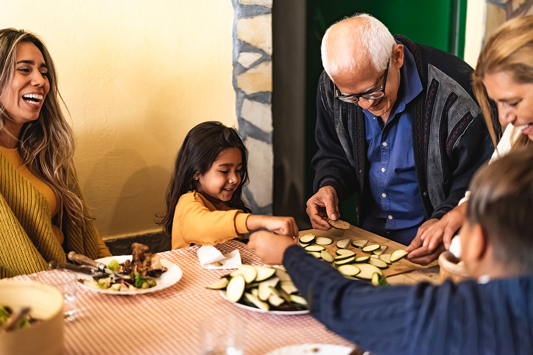 multigenerational family preparing a meal together