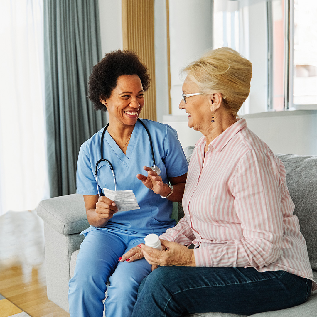 woman discussing medications with doctor in a residential care facility