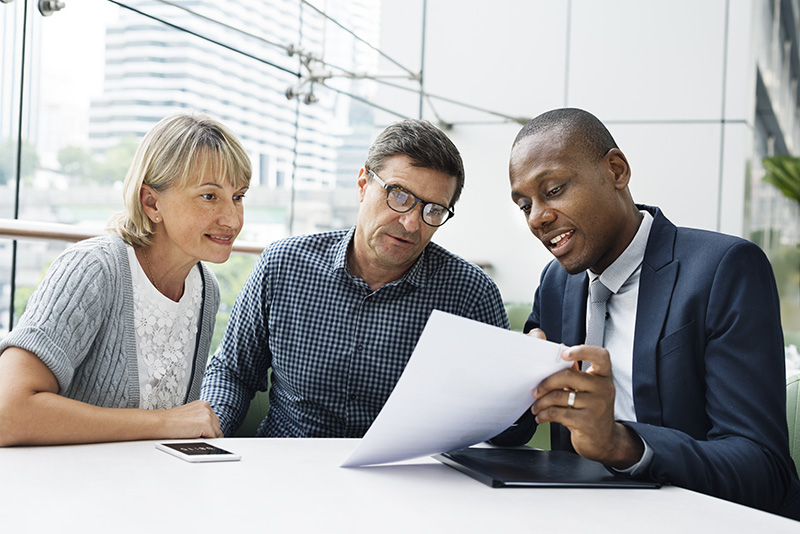 couple consulting with lawyer about estate planning