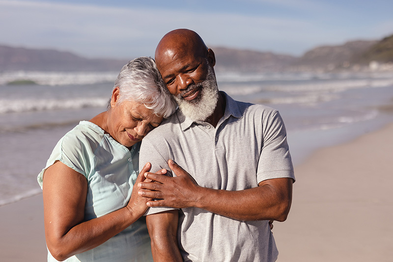 couple hugging on the beach