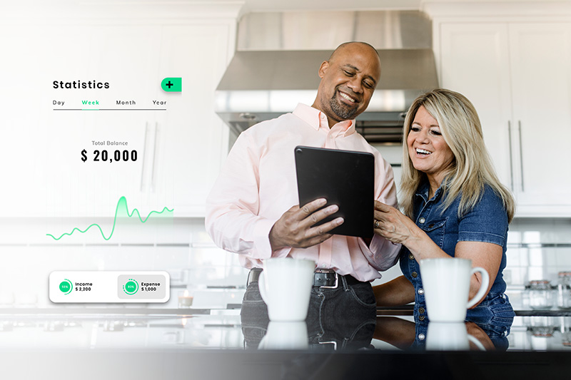 couple reviewing their retirement accounts on a digital pad