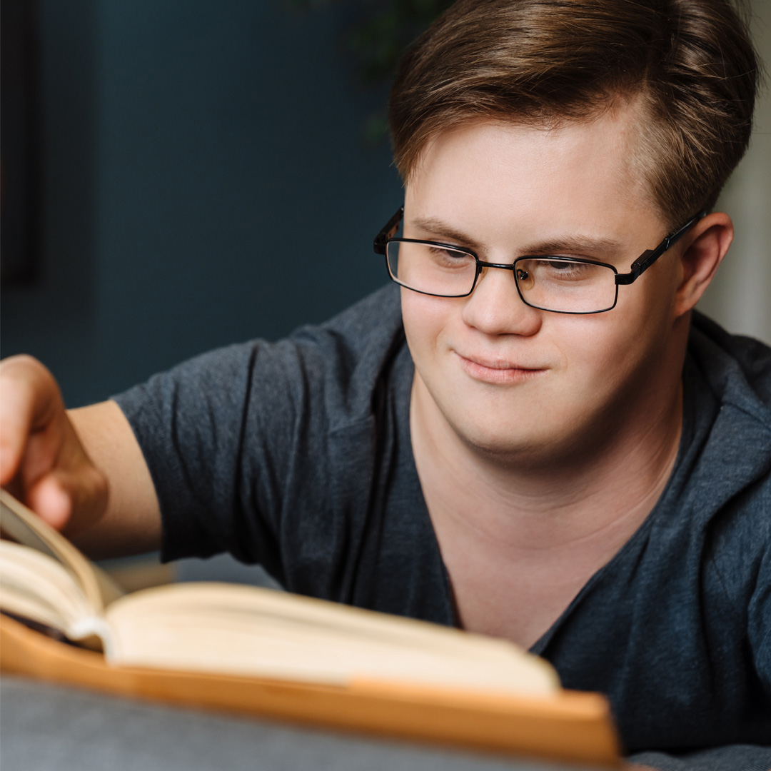 young man reading a book