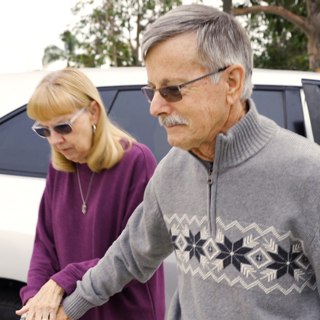 Bob and Cheryl getting out of a car