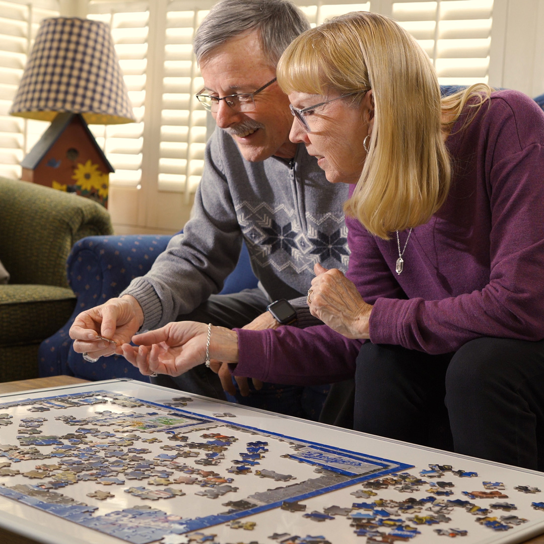 Bob and Cheryl working on a jigsaw puzzle together