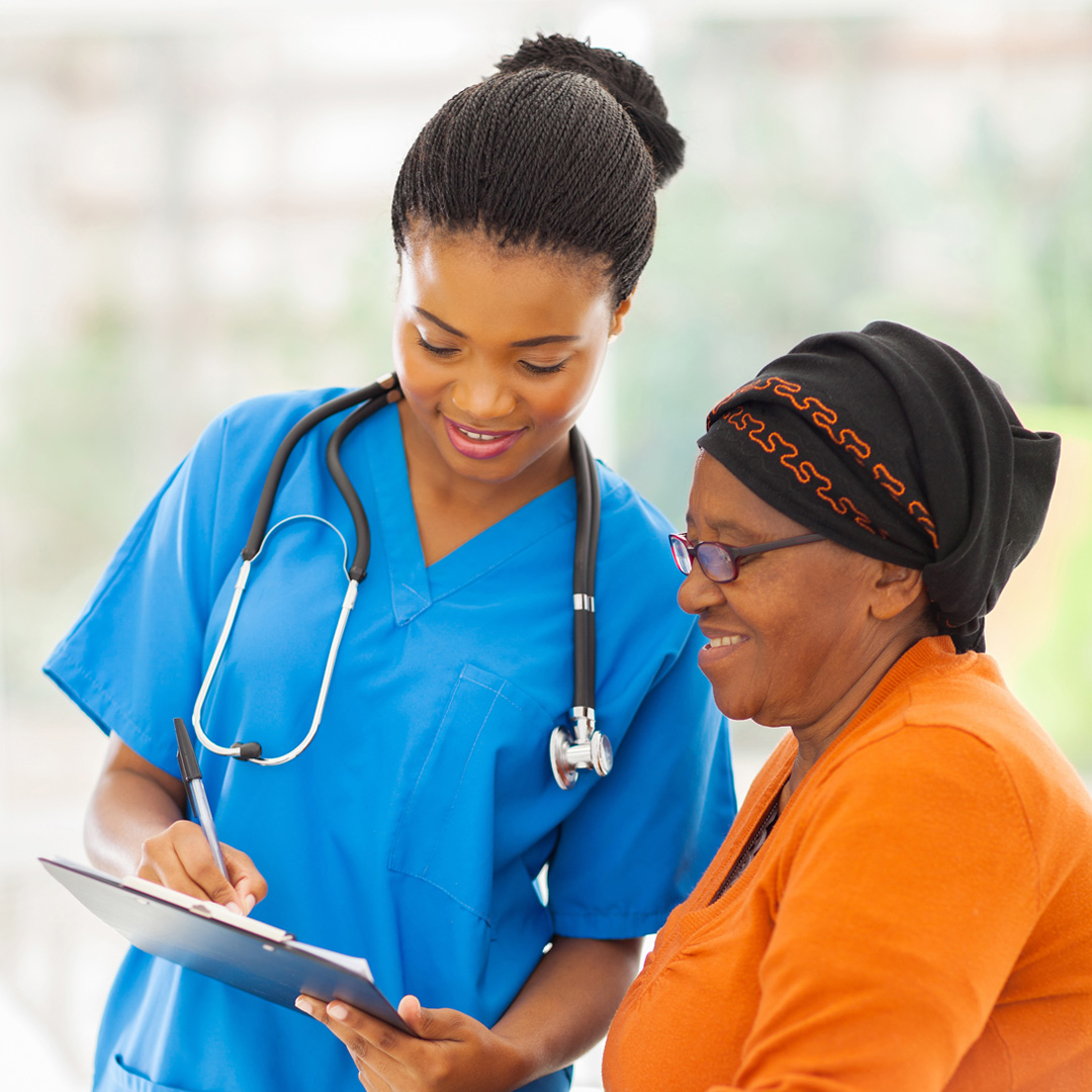 clinical trial researcher talking with woman