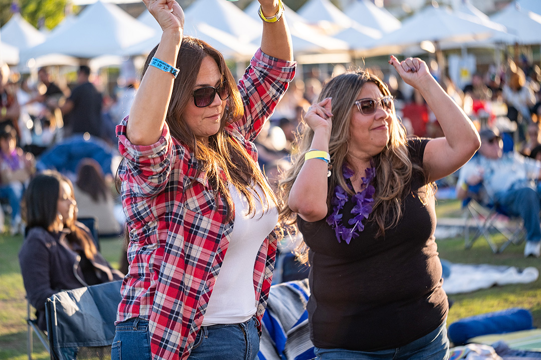 two women in the audience dancing