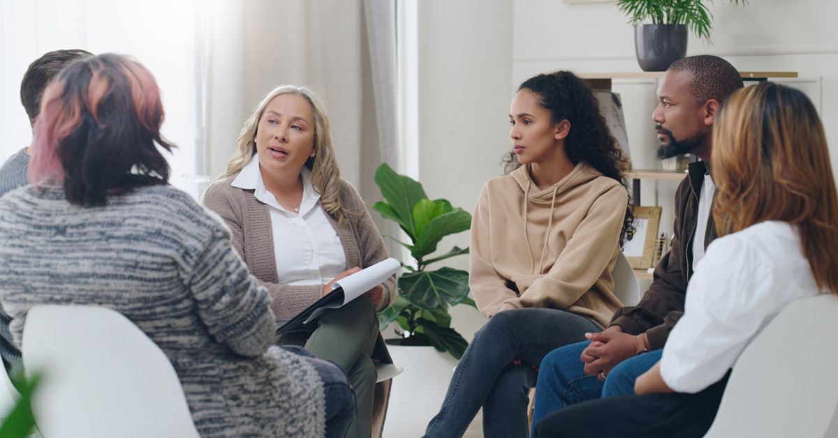 A support group leader talking to the group