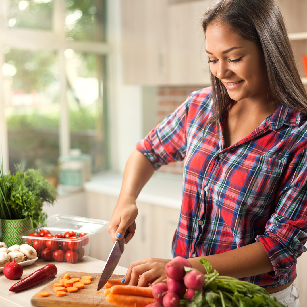 woman cutting vegetables