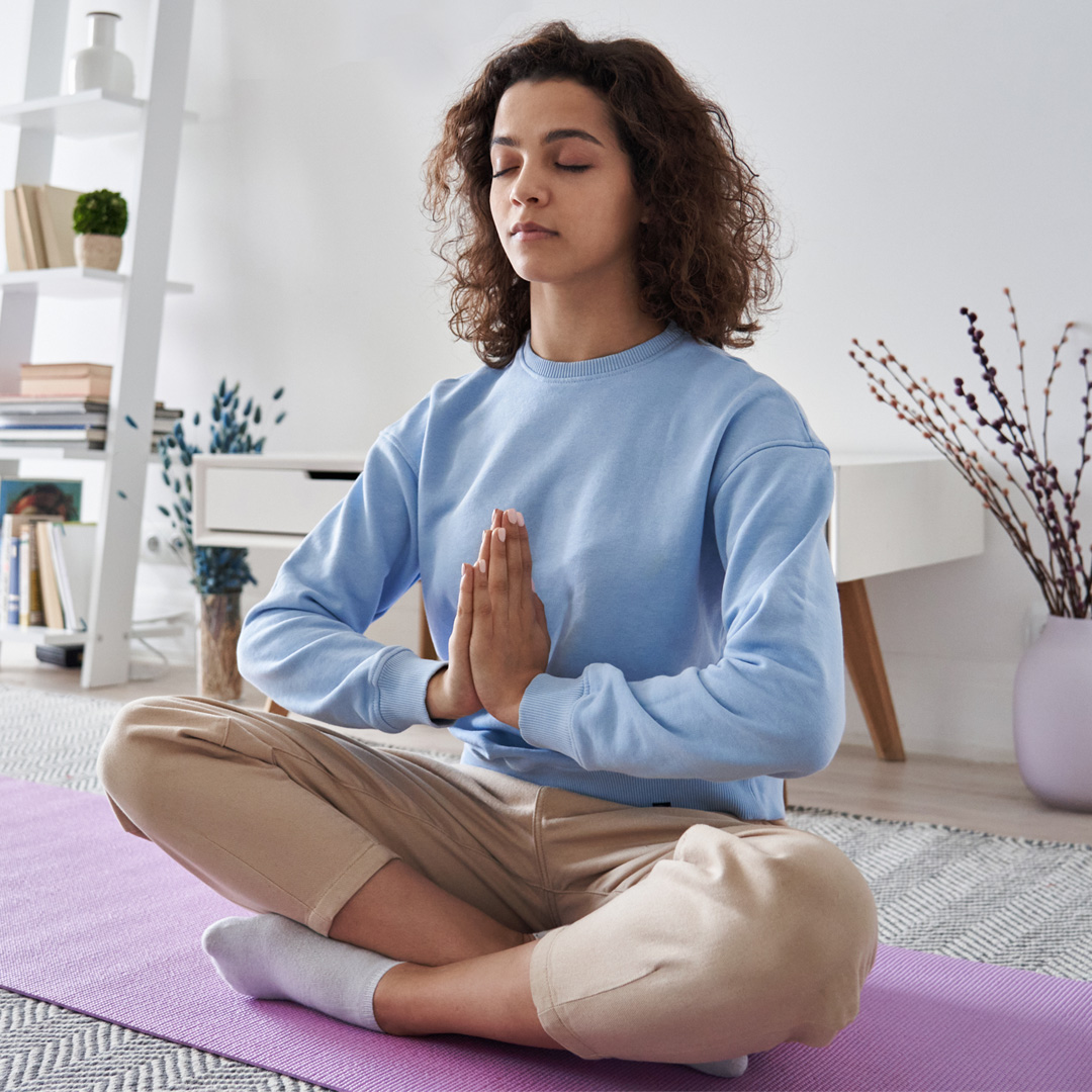 woman meditating at home