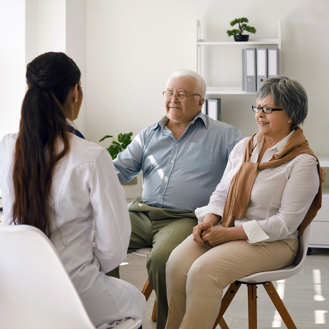 older couple talking with their doctor