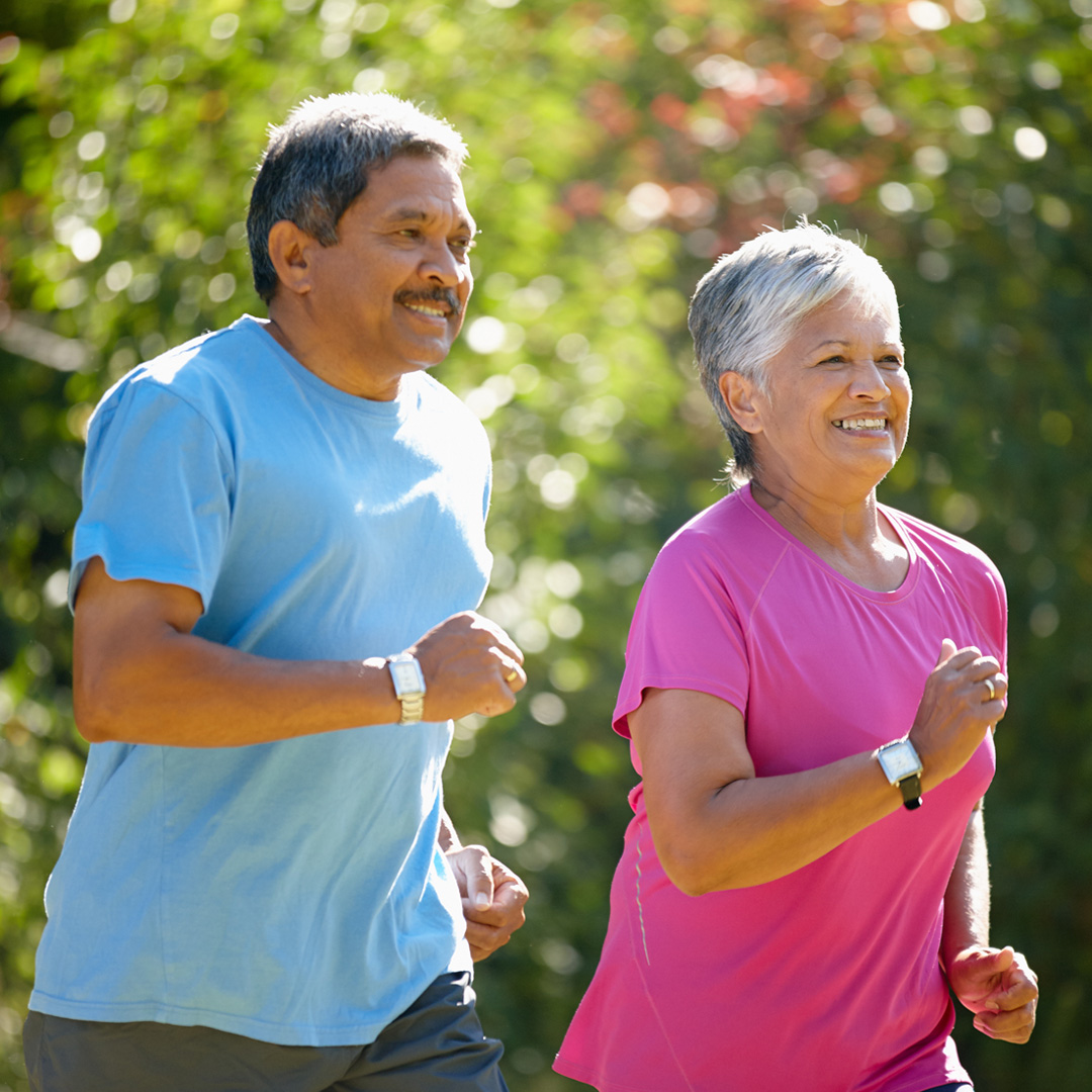 man and woman jogging in the park