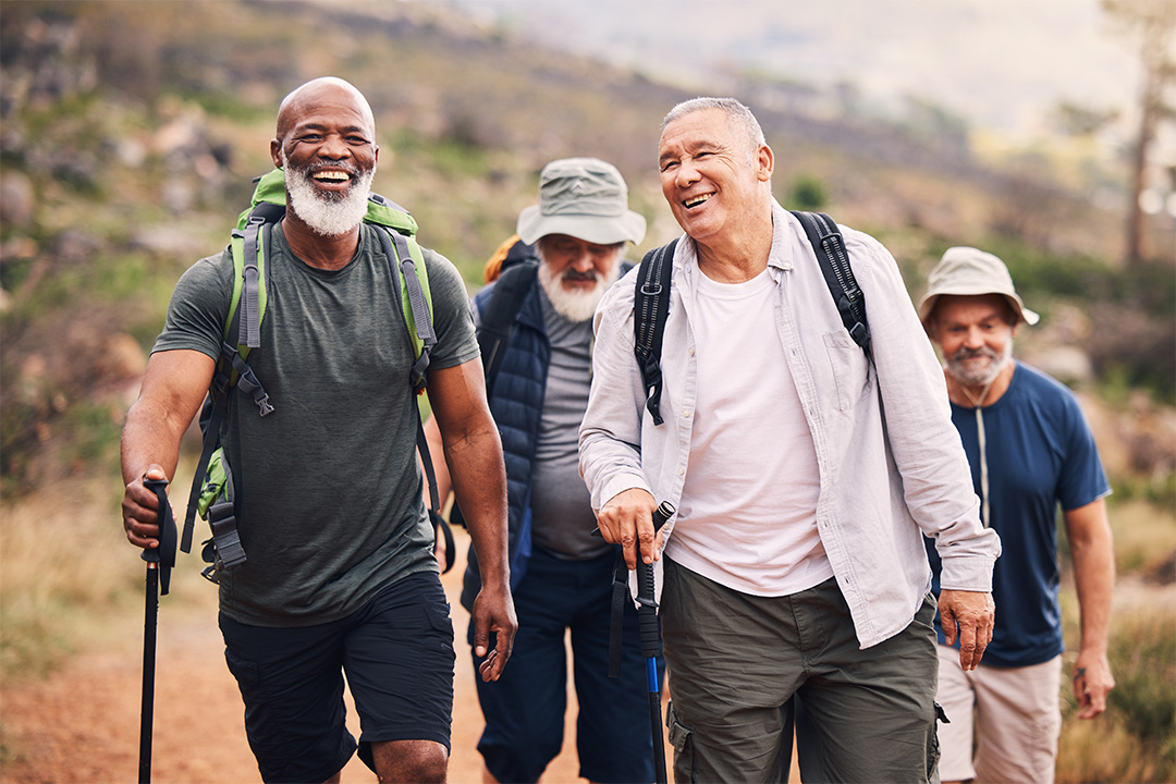 group of older male friends hiking together