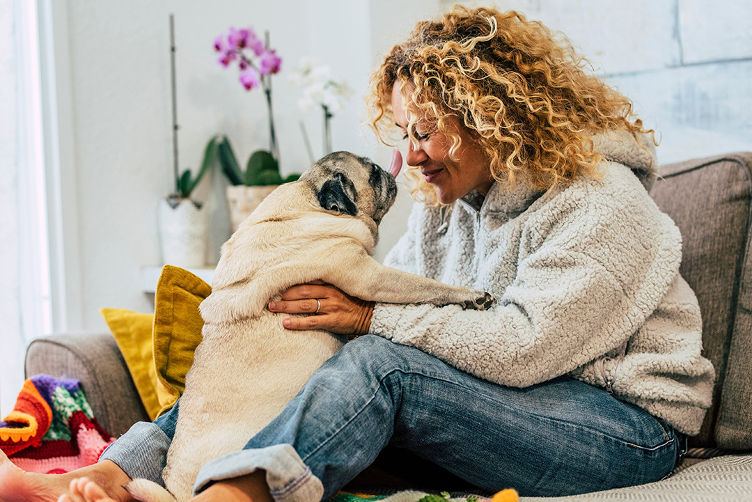 Care4ALZ-pet-therapy woman smiling with pet dog