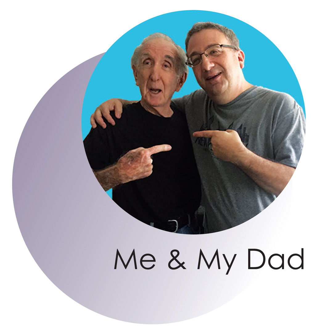 Josh and his father, smiling and pointing a finger at each other