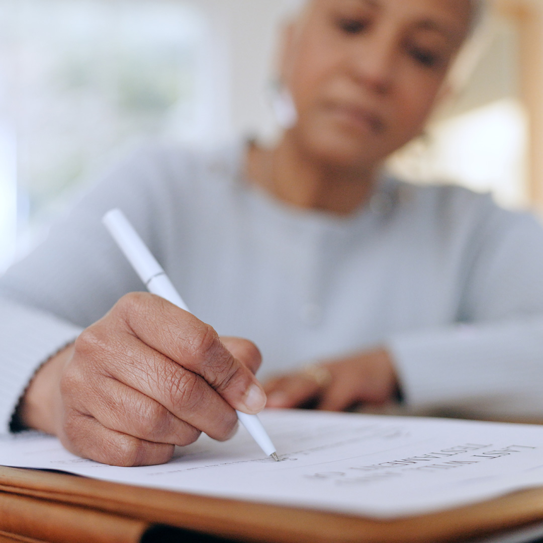 Woman signing a will