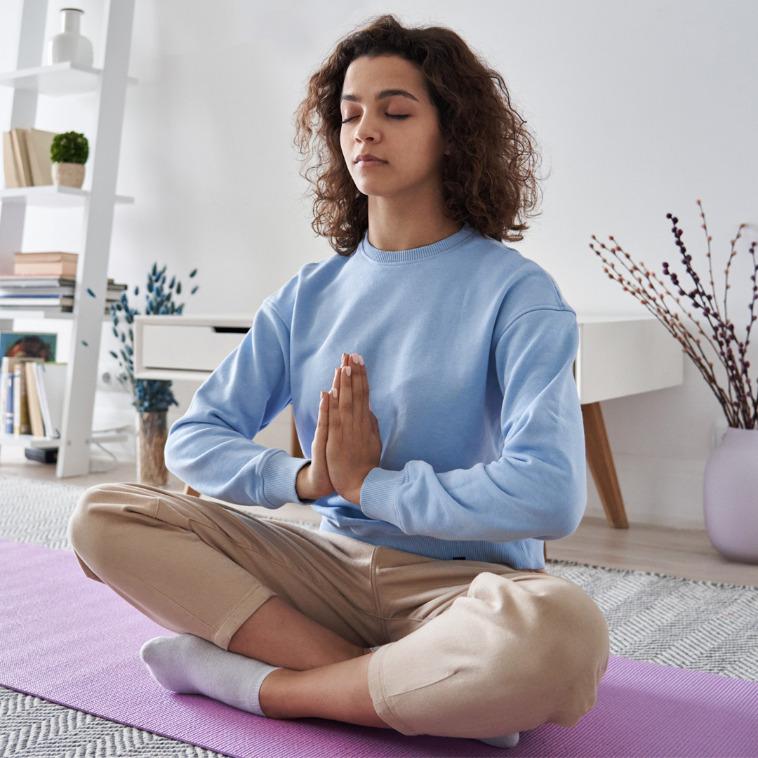 woman meditating at home