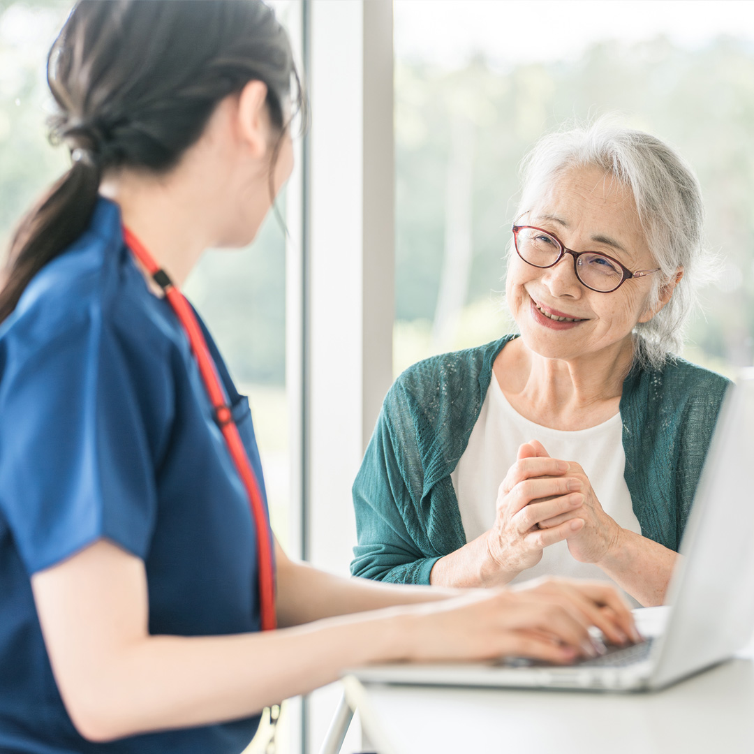 A dementia care manager talking with a client in her office
