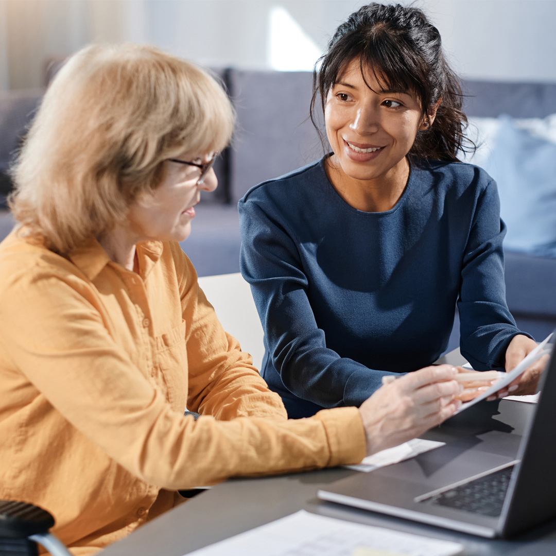 ECM-dementia-care-manager-02 A dementia care manager talking with a client in her office