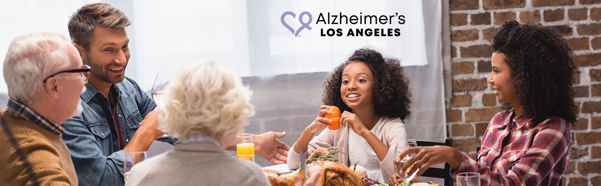diverse multigenerational family having Thanksgiving dinner together